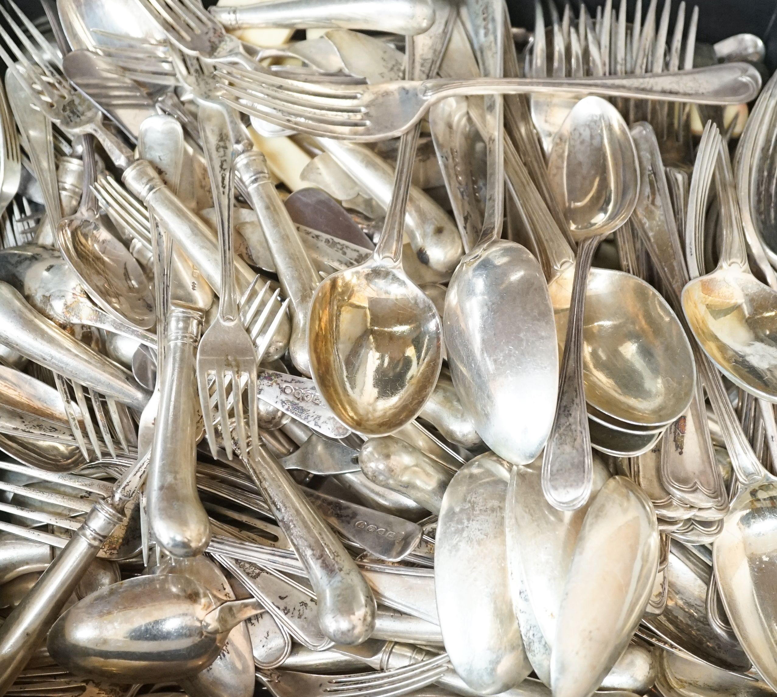 A mixed quantity of 19th century and later silver cutlery, including pistol handled fish eaters and pistol handled steel table and dessert knives, various date and makers, including a set of seventeen George IV table for